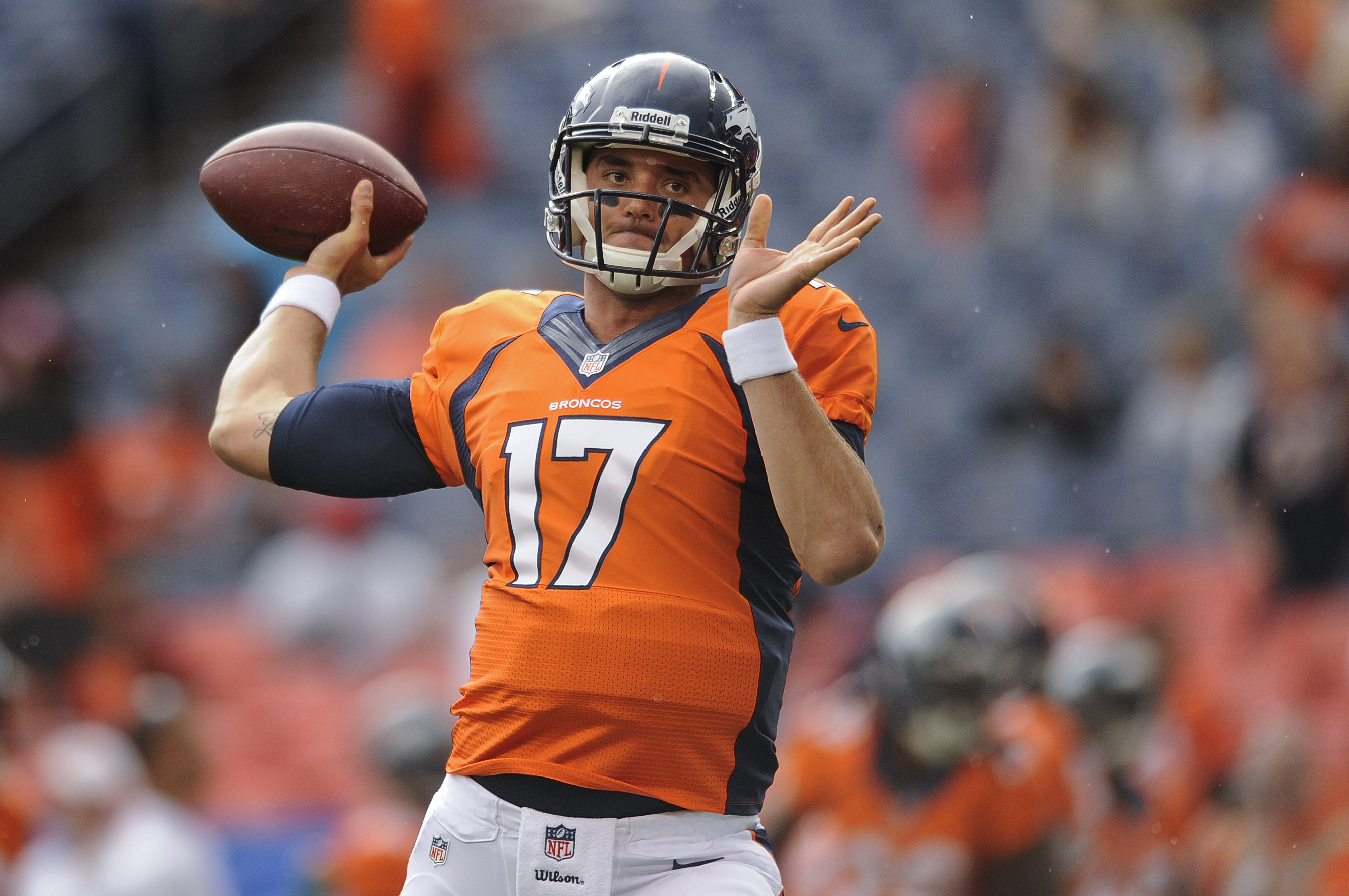 Denver Broncos quarterback Brock Osweiler (17) warms up before playing the St. Louis Rams in a preseason NFL football game, Saturday, Aug. 24, 2013, in Denver. (AP Photo/Jack Dempsey)